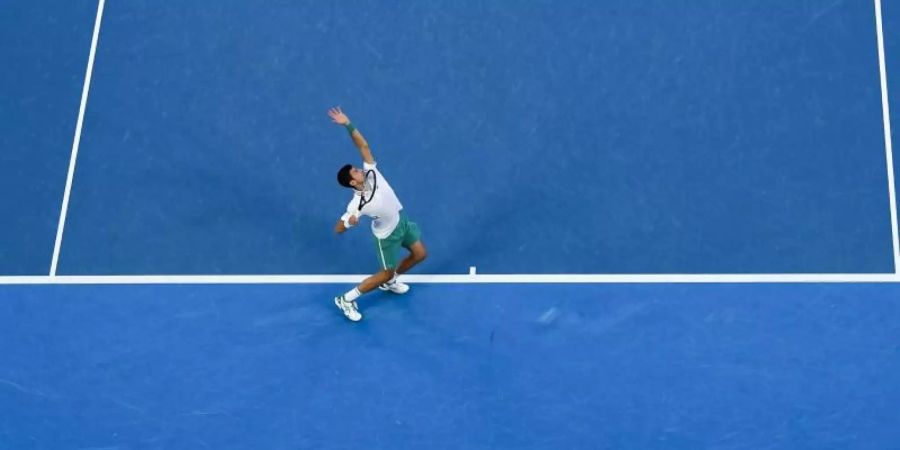 Würde gerne in Melbourne aufschlagen: der Serbe Novak Djokovic. Foto: James Ross/AAP/dpa/Archivbild