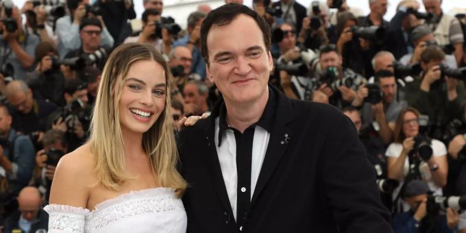 Margot Robbie (l) und Quentin Tarantino in Cannes. Quentin Tarantino