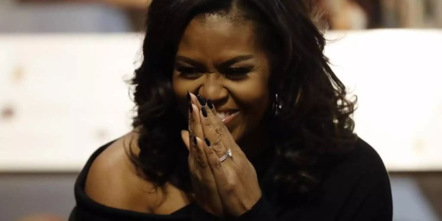 Michelle Obama hat die perfekte Wuftechnik. Foto: Matt Slocum/AP