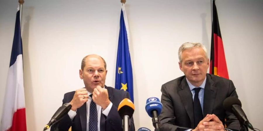 Bundesfinanzminister Olaf Scholz und der französische Wirtschaftsminister Bruno Le Maire während einer gemeinsamen Pressekonfenerz. Foto: Arne Immanuel Bänsch