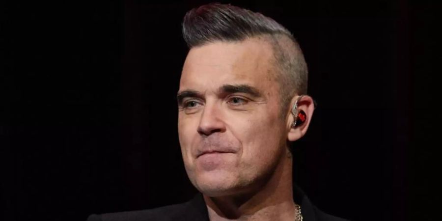 Robbie Williams 2019 in Hamburg bei einem Fankonzert. Foto: Georg Wendt/dpa