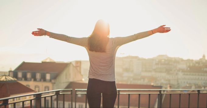 Woman on a sunny balcony