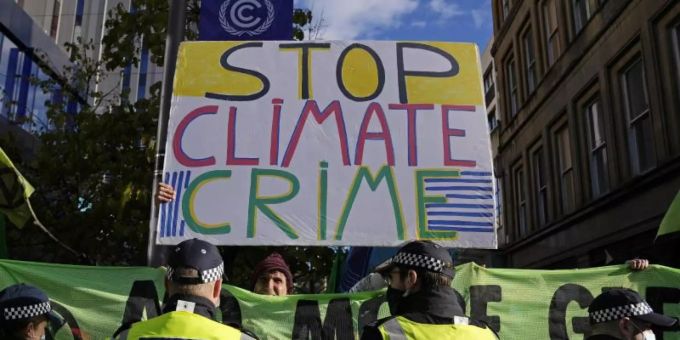 Ein Protest am Rande der COP26-Klimakonferenz in Glasgow. Symbolbild. Foto: Alastair Grant/AP/dpa