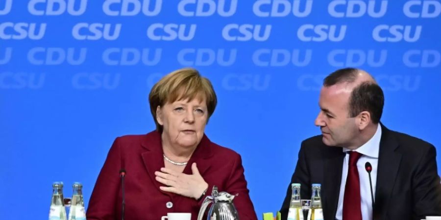 Merkel (l.) und Weber