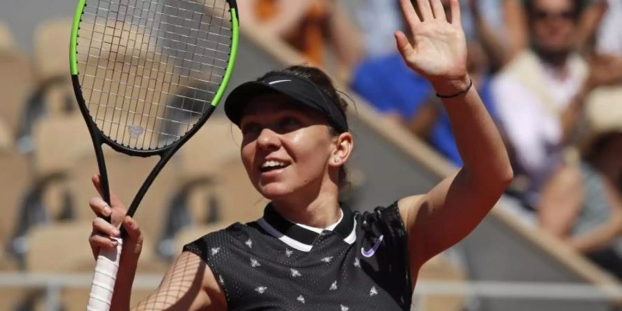 Simona Halep jubelt über ihren Sieg. Foto: Christophe Ena/AP