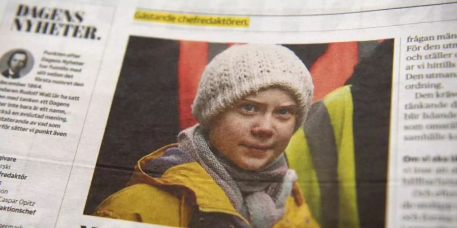 Ein Foto von Klima-Aktivistin Greta Thunberg ziert eine Seite der schwedischen Tageszeitung "Dagens Nyheter". Foto: Henrik Montgomery/TT NEWS AGENCY/AP/dpa