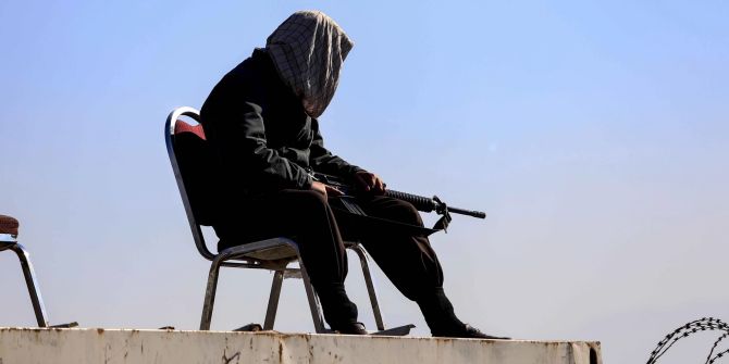 Taliban stand guard outside Kabul University in Kabul