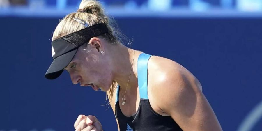 Kerber ballt die Faust und jubelt - gegen Jelena Ostapenko setzt sie sich 4:6, 6:2, 7:5 durch. Foto: Kareem Elgazzar/The Cincinnati Enquirer/AP/dpa