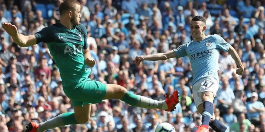 Tottenhams Eric Dier (l) versucht den Schuss von Manchester Citys Phil Foden zu blocken. Foto: Martin Rickett/PA Wire/dpa