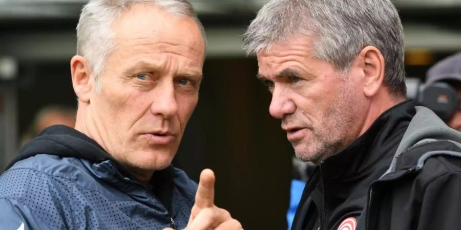 Die beiden Trainer Christian Streich und Friedhelm Funkel sind sich in ihrer Kritik am Videobeweis einig. Foto: Patrick Seeger