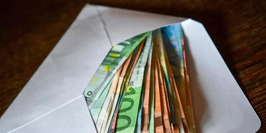 Nach einer kurzen Corona-Delle ist das Finanzvermögen deutscher Privathaushalte wieder auf Rekordniveau gestiegen. Foto: Patrick Pleul/dpa-Zentralbild/dpa