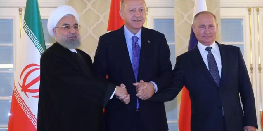 Irans Präsident Ruhani neben Gastgeber Erdogan und seinem russischen Amtskollegen Putin. Foto: arman/Iranian Presidency