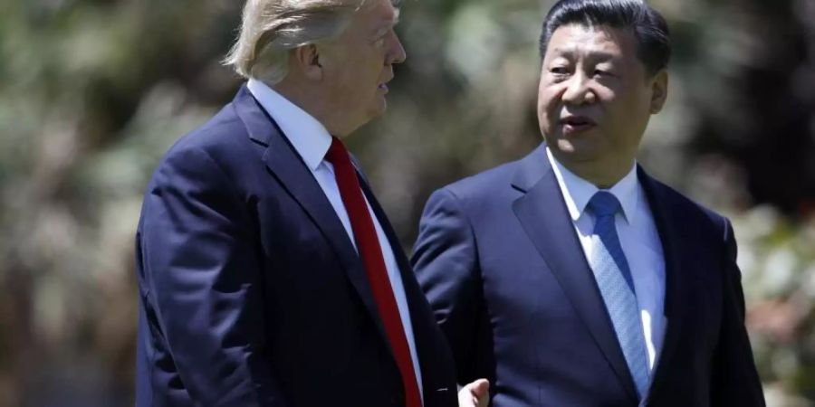 US-Präsident Trump und Chinas Staatschef Xi Jinping Anfang April 2017 nach einem Treffen in Florida. Foto: Alex Brandon/AP