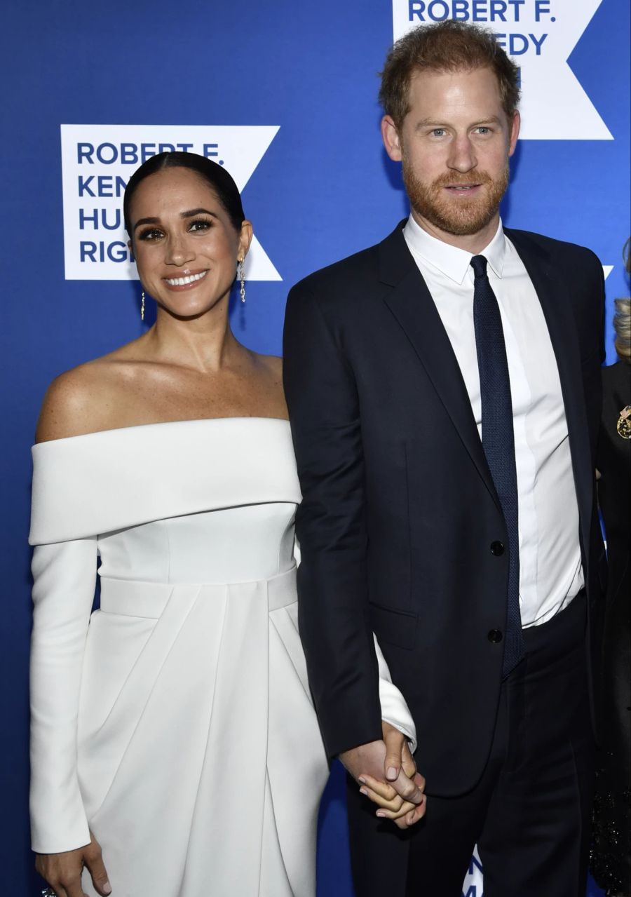 Meghan Markle und Prinz Harry strahlen um die Wette.