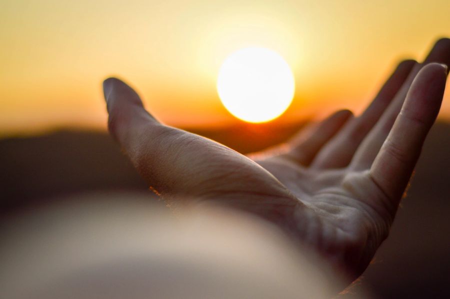 Sonnenuntergang und Hand