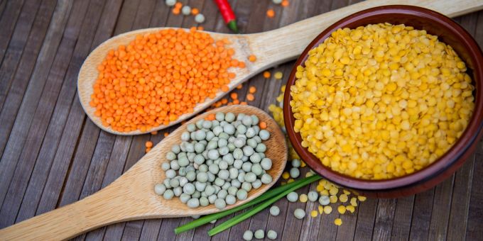Wooden spoon lentils yellow red peas