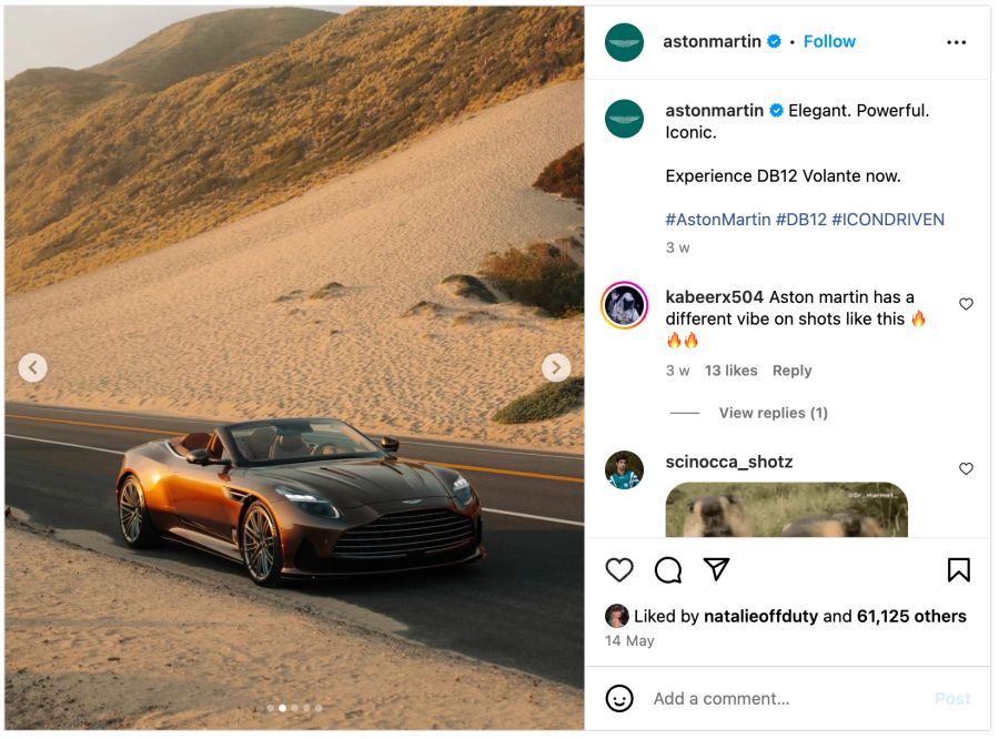 Instagram Post: Brauner Aston Martin Volante auf einer Strasse im Sand.