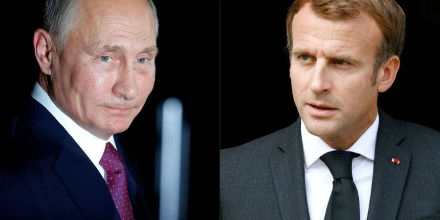 Wladimir Putin (l.) und Emmanuel Macron