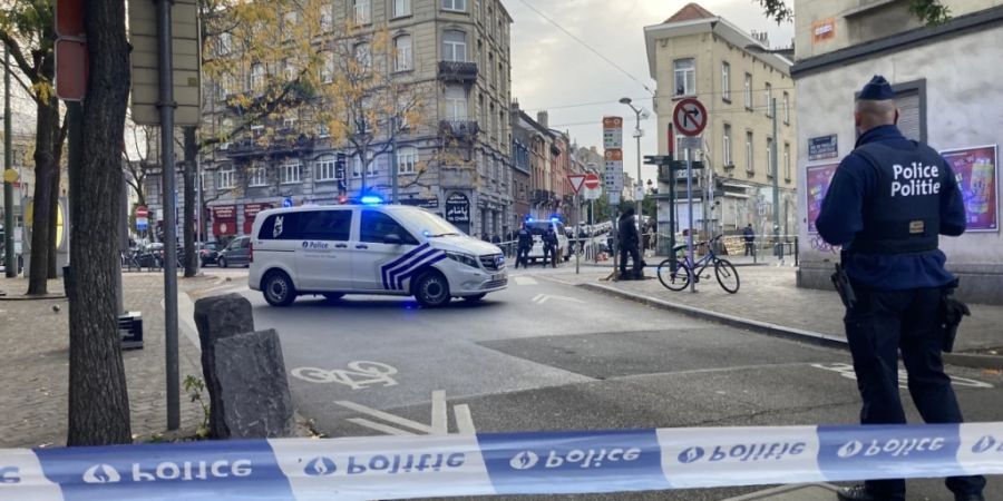 Polizeibeamte im Einsatz in Brüssel. Foto: Lou Lampaert/Belga/dpa