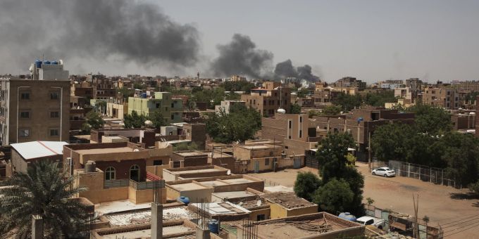 FILE - Smoke rises in Khartoum, Sudan, on April 22, 2023. In the country's capital, Sudan's army and the paramilitary group known as the Rapid Support Forces have battled in the streets with automatic rifles, artillery and airstrikes. An AP journalist, waiting for a chance to leave the country, sheltered with a diverse group of more than a dozen people who hunkered down in a small hotel in central Khartoum. (AP Photo/Marwan Ali, File) Sudan Diary