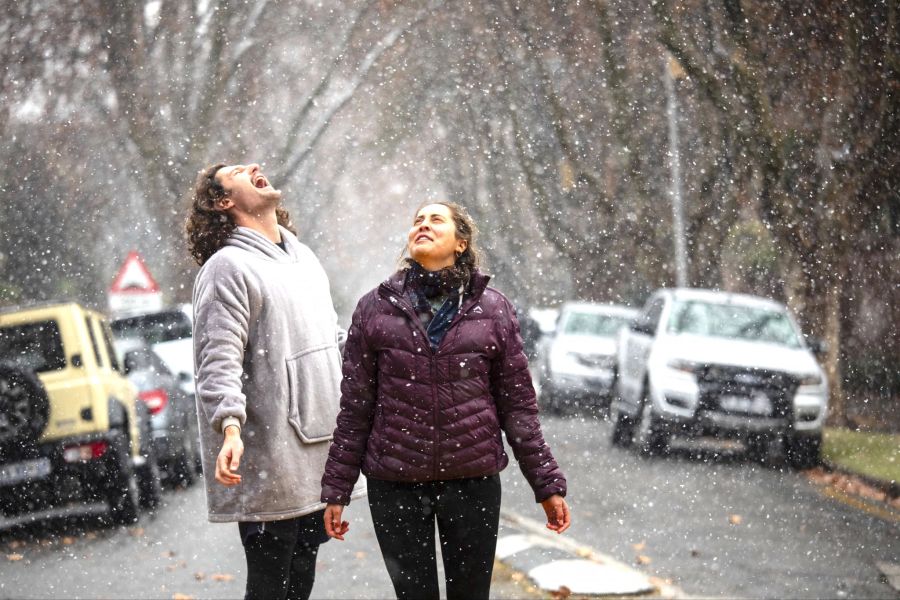 People enjoy rare snowfall