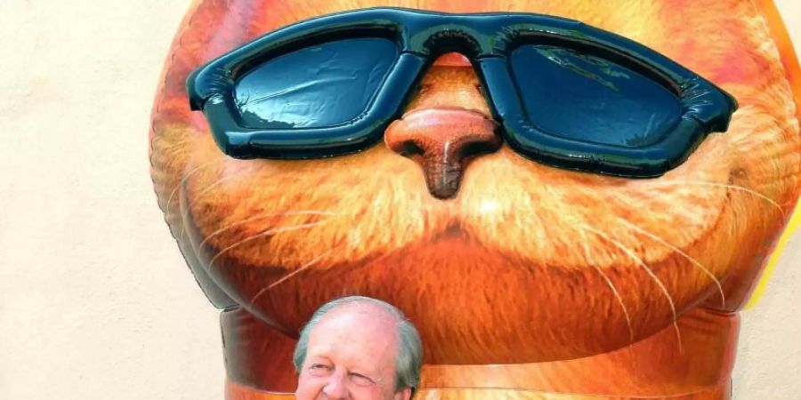 Der Comic-Zeichner und seine Schöpfung: Jim Davis und Garfield. Foto: Nina Prommer/Globe Photos/ZUMAPRESS.com/dpa