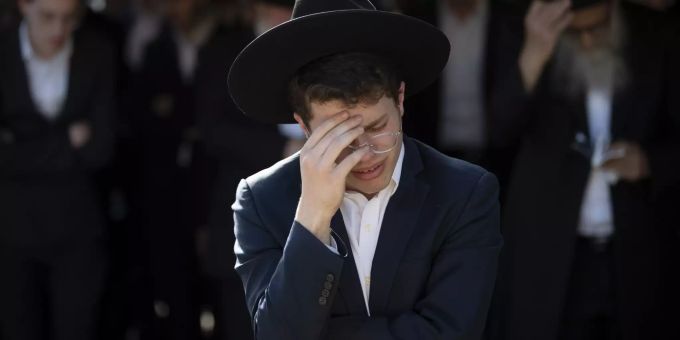Ultra-Orthodox Jews mourn during the funeral of Moshe Ben Shalom at a cemetery in Petah Tikva, Israel, Friday, April 30, 2021. Moshe Ben Shalom and several others died and others were injured during a stampede at Lag BaOmer celebrations, a religious festival attended by tens of thousands of ultra-Orthodox Jews in Mt. Meron, northern Israel early Friday. It was one of the country's deadliest civilian disasters (AP Photo/Oded Balilty) APTOPIX Israel Festival Stampede