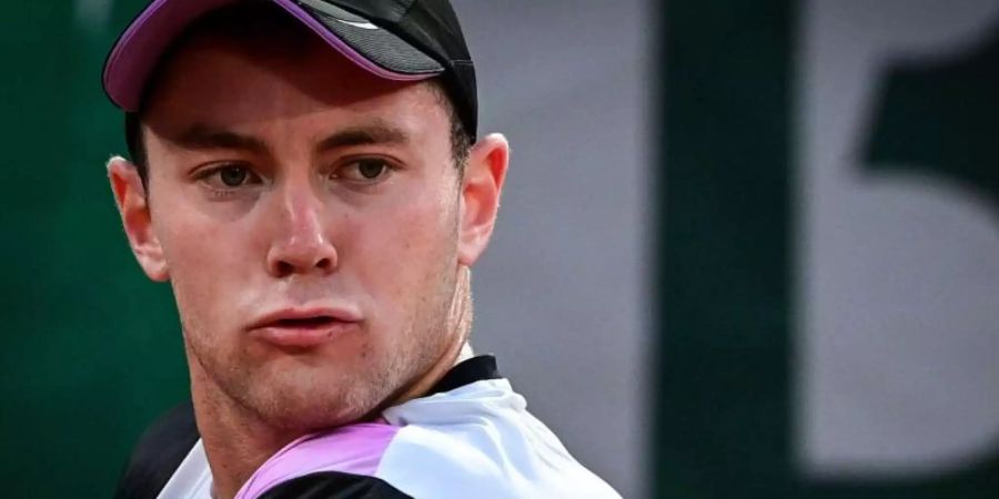 Tritt beim Rasen-Turnier in Stuttgart an: Dominik Koepfer. Foto: Martin Bureau/AFP/dpa