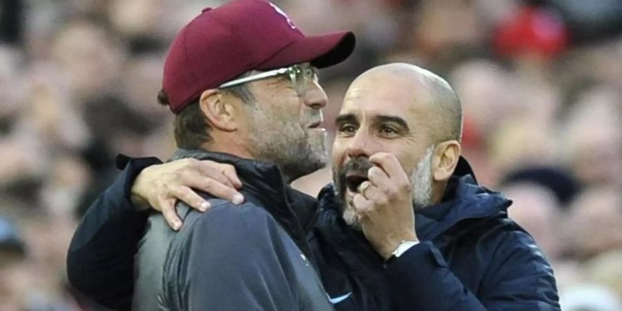 Spricht mit grosser Hochachtung von Jürgen Klopp: Pep Guardiola (r). Foto: Rui Vieira/AP/dpa