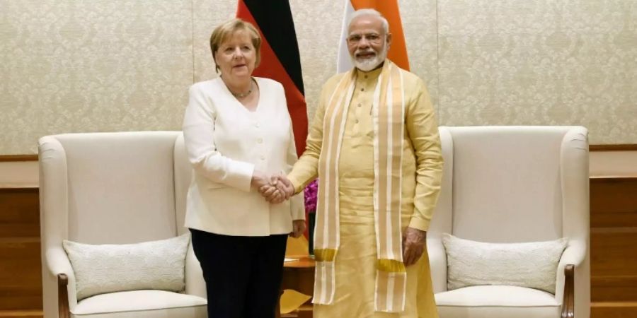 Merkel (l.) und Modi