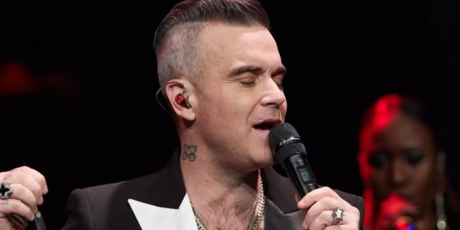 Robbie Williams hofft, dass sein Weihnachts-Album ein riesen Erfolg wird. Foto: Georg Wendt/dpa