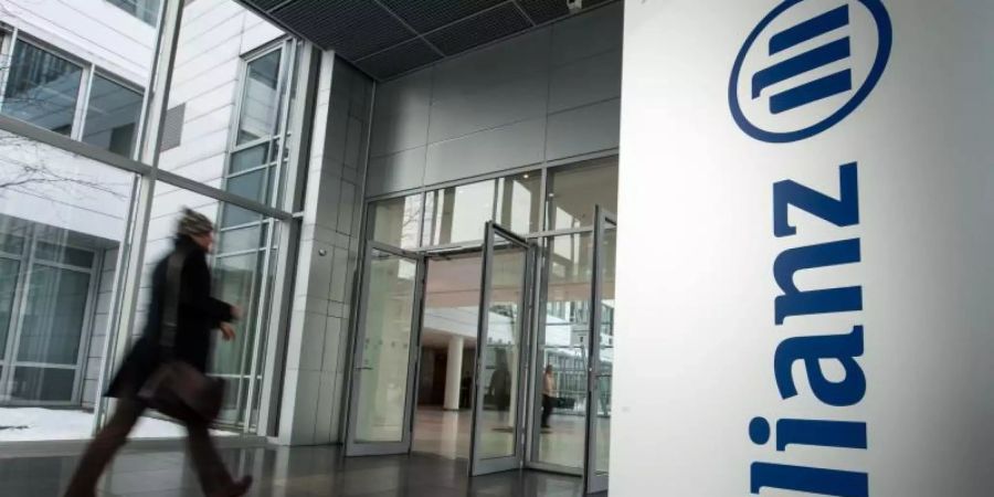 Für die Allianz steht unter dem Strich ein Überschuss von fast 2,1 Milliarden Euro. Foto: picture alliance / Armin Weigel/dpa