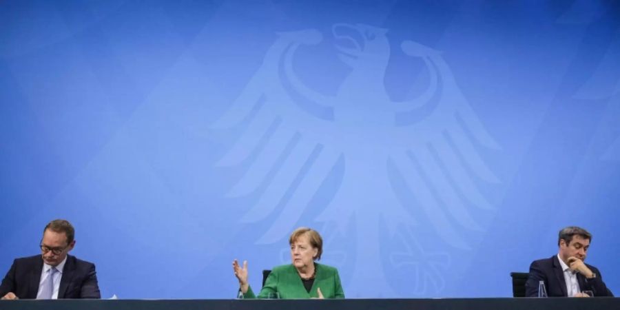 Kanzlerin und Länderchefs nach Corona-Beratungen im März