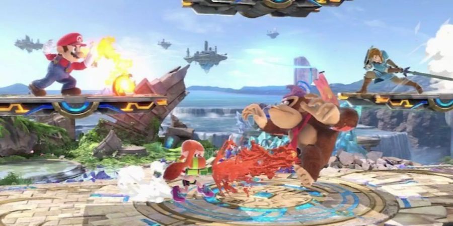 Ein Screenshot aus Super Smash Bros. Ultimate. Mario, Inkling, Donkey Kong und Link kämpfen.