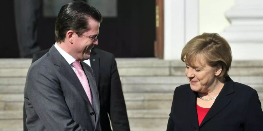 Guttenberg und Merkel im Jahr 2011