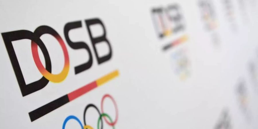 Das Logo des Deutschen Olympischen Sportbundes (DOSB). Foto: Britta Pedersen/dpa-Zentralbild/dpa