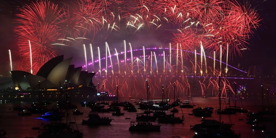 The midnight fireworks are seen over the Sydney Opera House and Sydney Harbour Bridge during New Years Eve celebrations in Sydney, Sunday, January 1, 2023. (AAP Image/Bianca De Marchi) NO ARCHIVING