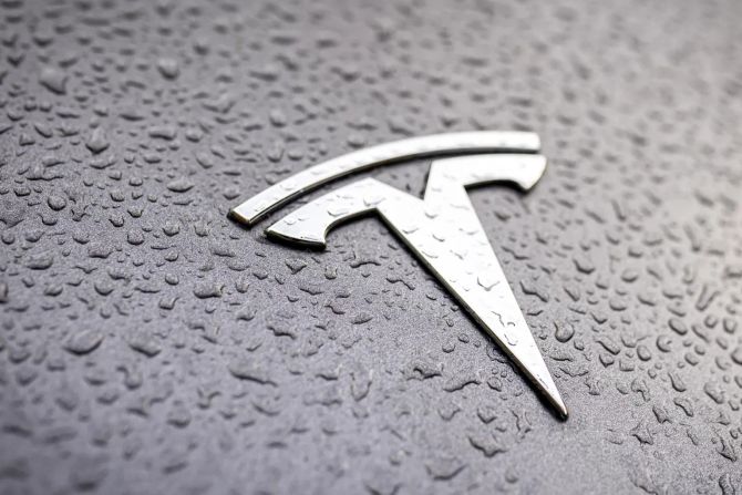 tesla logo symbol