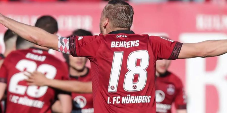 FCN-Kapitän Hanno Behrens und seine Teamkollegen hatten endlich wieder Grund zum Jubel. Foto: Daniel Karmann/dpa