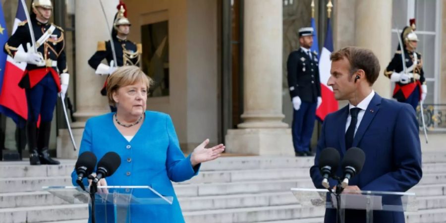 Bundeskanzlerin Merkel und Frankreichs Präsident Macron