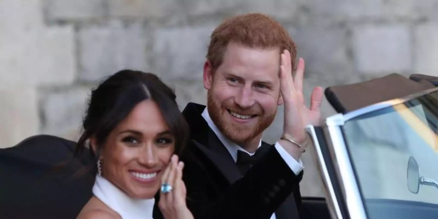 Prinz Harry und seine Frau Meghan nach ihrer Trauung im Mai 2018. Foto: Steve Parsons/PA Wire/dpa