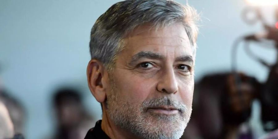 George Clooney will gemeinsam mit seinem Produktionspartner Grant Heslov eine Doku-Serie über einen Missbrauchsskandal an einer US-Universität produzieren. Foto: Ian West/PA Wire/dpa/Archiv