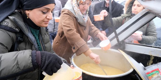 People receive free meals after a major earthquake in Diyarbakir