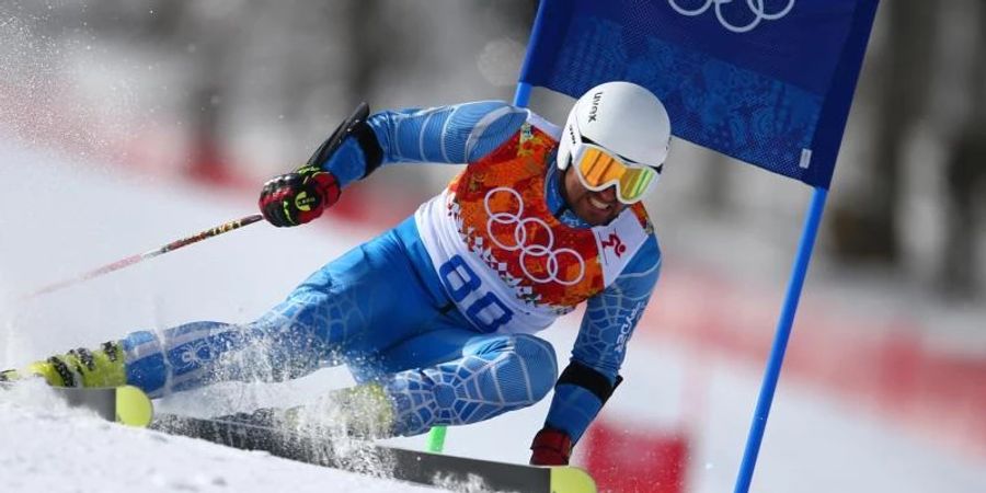 Der iranische Skirennfahrer Hossein Saveh Shemshaki fährt bei den Winterspielen in Sotschi 2014 die Piste herunter. Foto: picture alliance / dpa