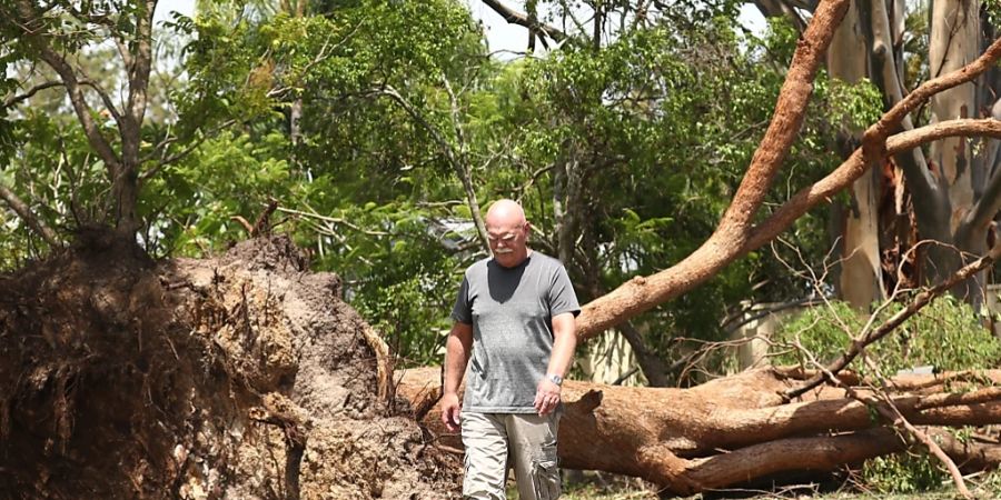 Storm damage is seen at Ruth Tce in Oxenford on the Gold Coast , Queensland, Wednesday, December 27, 2023. Storms ravaging Queensland have claimed six lives since Christmas Day with one person missing in floodwaters. (AAP Image/Jason O?Brien) NO ARCHIVING