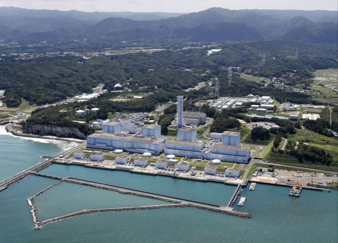 ARCHIV - 17.06.2018, Japan, Fukushima: Das Atomkraftwerk Fukushima Daiichi des Energieunternehmens Tokyo Electric Power Company Holdings Inc. (TEPCO) von einem Hubschrauber aus aufgenommen. Atomkraftwerk Fukushima