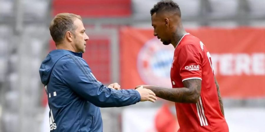 Erfolgs-Duo: Bayern-Coach Hansi Flick und Jérôme Boateng. Foto: Sven Hoppe/dpa-Pool/dpa