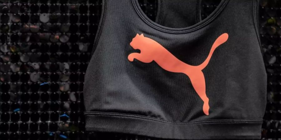 Puma will die steigenden Kosten aktuell nicht an die Kunden weitergeben. Foto: Daniel Karmann/dpa/Symbolbild