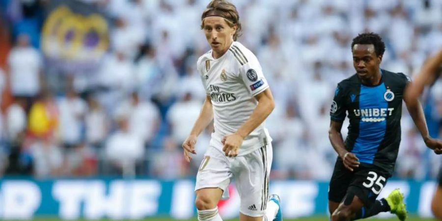 Luka Modric (l) und Real Madrid taten sich schwer gegen den FC Brügge. Foto: Bruno Fahy/BELGA/dpa