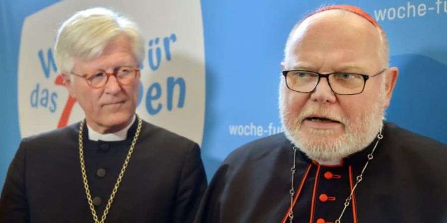 EKD-Ratsvorsitzender Bedford-Strohm (l.), Kardinal Marx